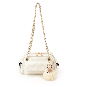White quilted shoulder bag with gold chain strap and cute plush charm on white background