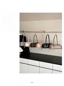 Selection of chic faux leather baguette bags in six neutral colors with metal buckles
