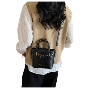 Vintage black leather bucket bag with gold hardware and stylish shoulder strap for women