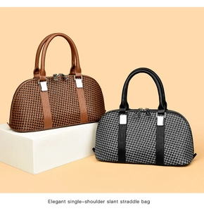 Detail of houndstooth plaid bowling bags with premium leather trim and silver hardware