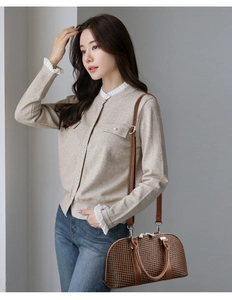 Chic model style showing a brown houndstooth shell handbag with a knit cardigan outfit