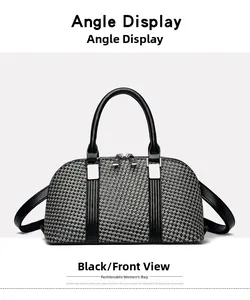 Front view detail of a black woven Boston handbag with leather handles and silver hardware