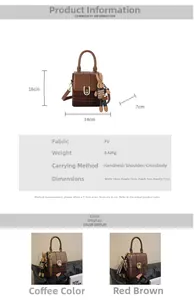 Detail view of plaid box bag with cute rabbit pendant and adjustable shoulder strap