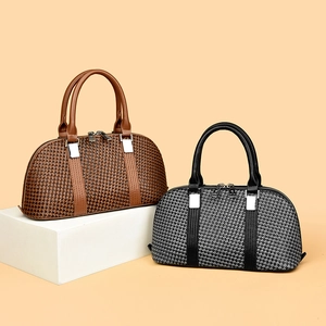 Retro houndstooth boston handbag in brown and black with silver buckles and leather handles