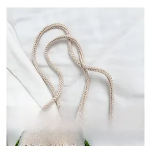 Close-up of handmade floral crochet bag showing woven texture and thick shoulder strap