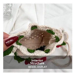 Detailed internal structure view of handmade crochet floral bag with strawberry accents