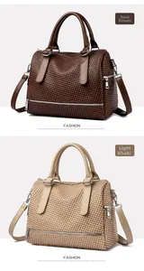 Detail of woven texture on brown and khaki Boston style tote bags with leather straps