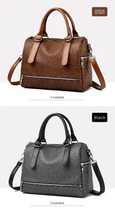 Detail view of woven texture and metal zippers on fashionable Boston crossbody bag