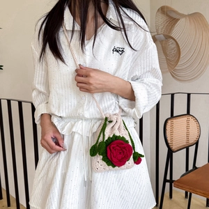 Handmade crochet crossbody bag with 3D red roses and white knitted floral design
