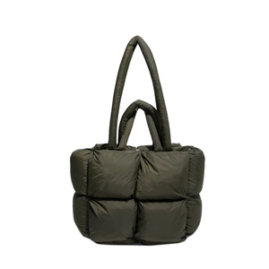 Deep green quilted puffer tote bag with woven cassette texture and dual top handles