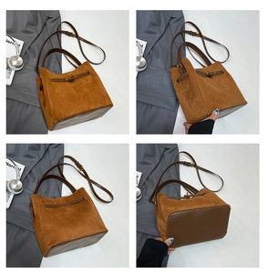 Détails du sac seau en daim marron mat avec lanières en cuir et fermoir en métal doré