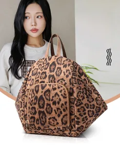 Detailed view of large capacity leopard print backpack with durable fabric and front pocket