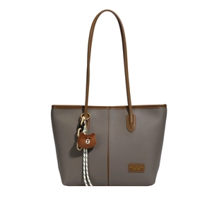 Fashionable taupe lychee leather tote bag with brown straps shown on white background