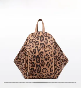 Detailed view of leopard print backpack showing triangle shape and front zipper pocket