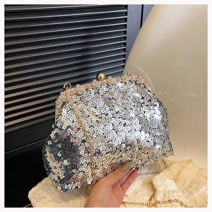 Silver sequin evening clutch featuring flower rhinestone clasp and golden chain strap