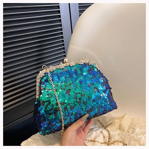 Close-up of teal gradient sequins and plum blossom rhinestone clasp on the evening clutch