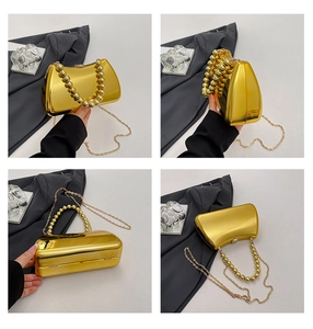 Detailed views of gold hard-shell evening clutch with acrylic bead handle and chain strap