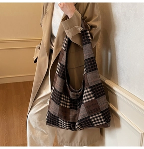 Detail view of vintage checkered tote bag styled with a stylish khaki autumn trench coat