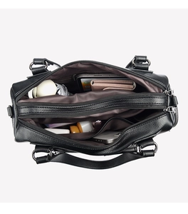 Detailed interior view showing multiple compartments and high capacity of black leather tote