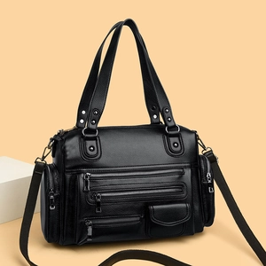Black pebbled leather multi-pocket tote bag with silver hardware and woven strap