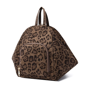 Stylish leopard print backpack with gold zipper and front pocket on white background