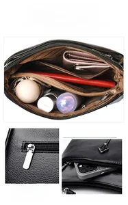 Internal compartments of black pebble leather tote bag showing large capacity