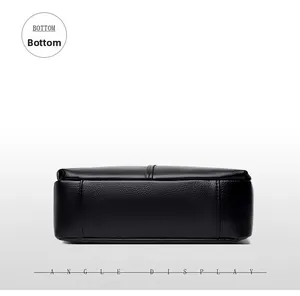 Detailed bottom view showing black lychee grain leather texture and central stitching