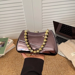 Elegant purple mirror metallic evening bag with distinctive gold bead handle for women
