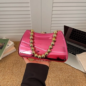 Magenta mirror finish evening clutch with round gold bead handle and crossbody chain strap
