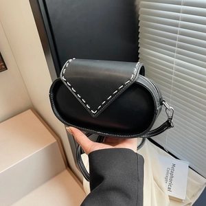 Retro black oval crossbody bag with white V-shaped stitching and silver metal hardware