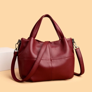 Vintage burgundy tote bag in lychee leather texture with adjustable shoulder strap