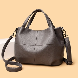 Dark grey pebble leather tote bag with cross-stitch design and adjustable shoulder strap