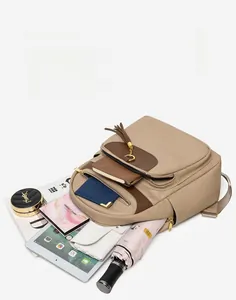 Large capacity backpack interior showing iPad, umbrella, and cosmetics in multiple layers