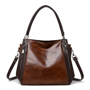 Brown vintage faux leather tote bag with dual zipper detail and adjustable strap