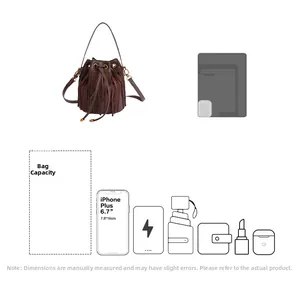 Detail showing high capacity of dark brown suede bucket bag for daily essentials