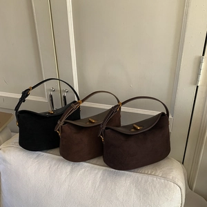 Detailed comparison of three retro suede dumplings bags in black and brown with metal locks