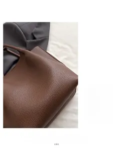 Detailed macro view of the brown lychee pattern leather and soft grain texture