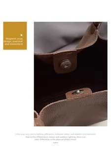Detail of caramel leather bucket bag featuring magnetic closure and pebble grain texture