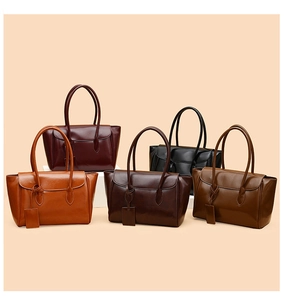 Detailed view of large capacity faux leather tote bags in five assorted solid colors