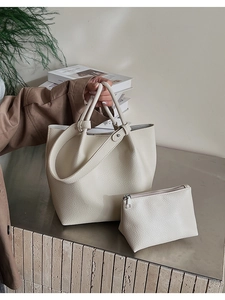 Detailed view of beige lychee texture tote bag set with matching small zipper pouch