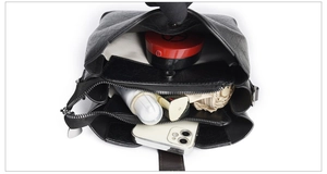 Top view of spacious interior compartments in black textured leather bucket bag