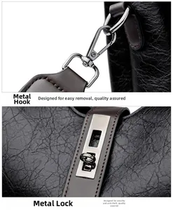 Detail of metal lobster clasp and twist lock on black textured leather bucket bag