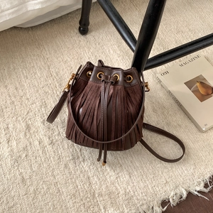 Retro brown suede fringe bucket bag with drawstring closure and golden hardware