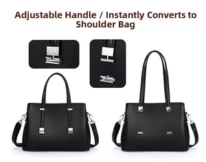 Detail of adjustable silver buckle on black leather bag for handbag to shoulder conversion