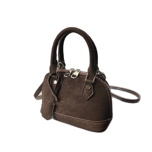 Sac à main vintage marron foncé en forme de coquille avec bandoulière réglable