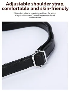 Detail of adjustable black leather strap with polished silver metal buckle and fine stitching