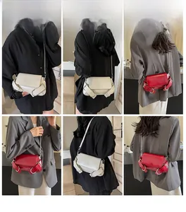 Detailed views of crossbody bags in off-white and red with metal chain straps