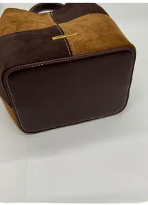 Detail of reinforced leather base and contrast stitching on vintage bucket bag