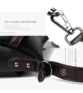 Detail of lychee pattern leather handbag with detachable strap and gunmetal hardware