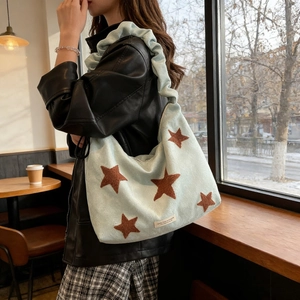 Light blue embroidered star shoulder bag with trendy pleated cloud strap for women